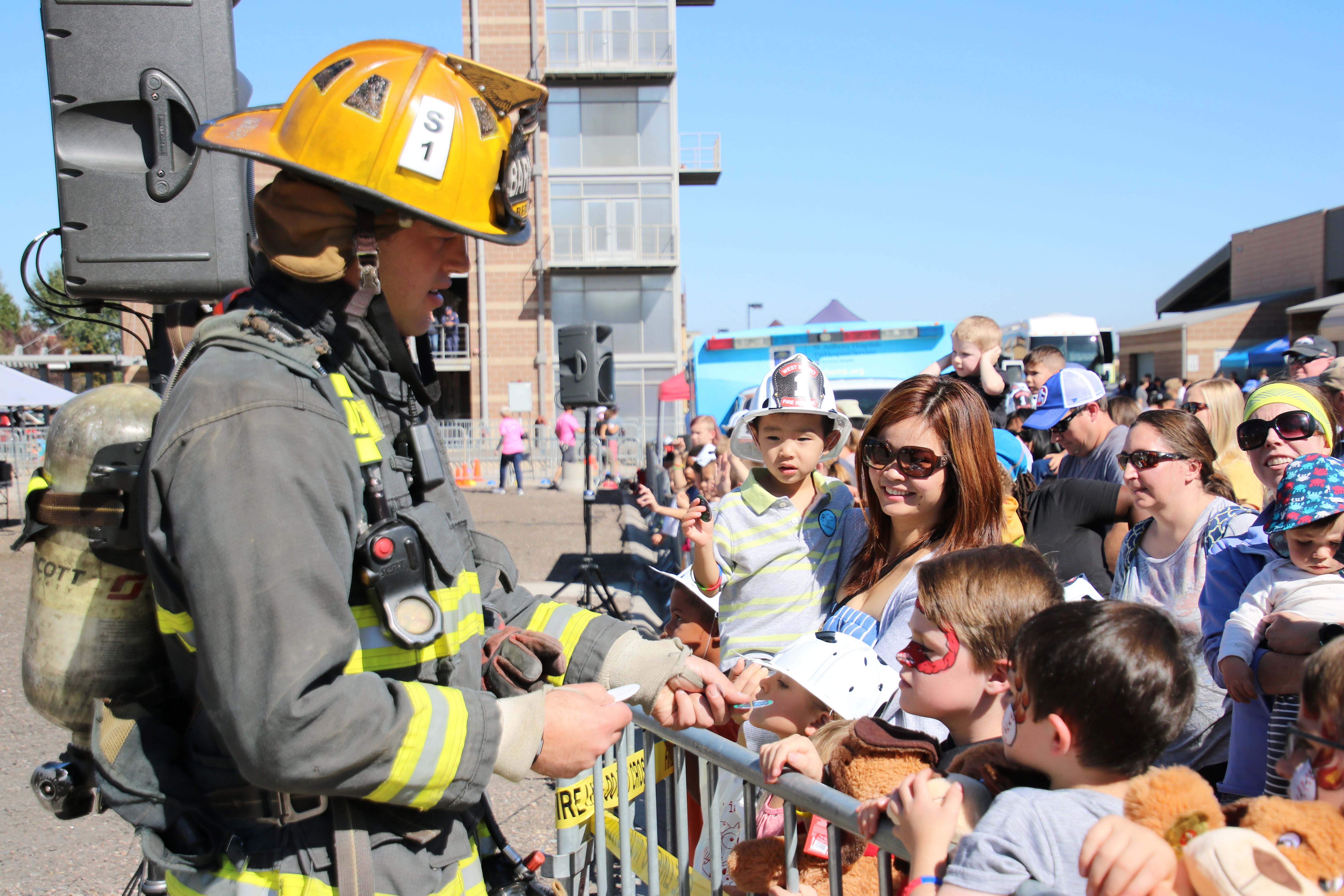 Firefighter talking to kids